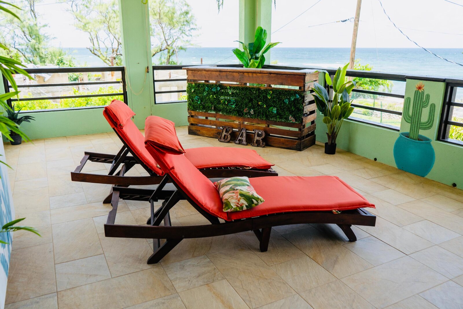 Loungers overlooking the ocean at Hidden Gem