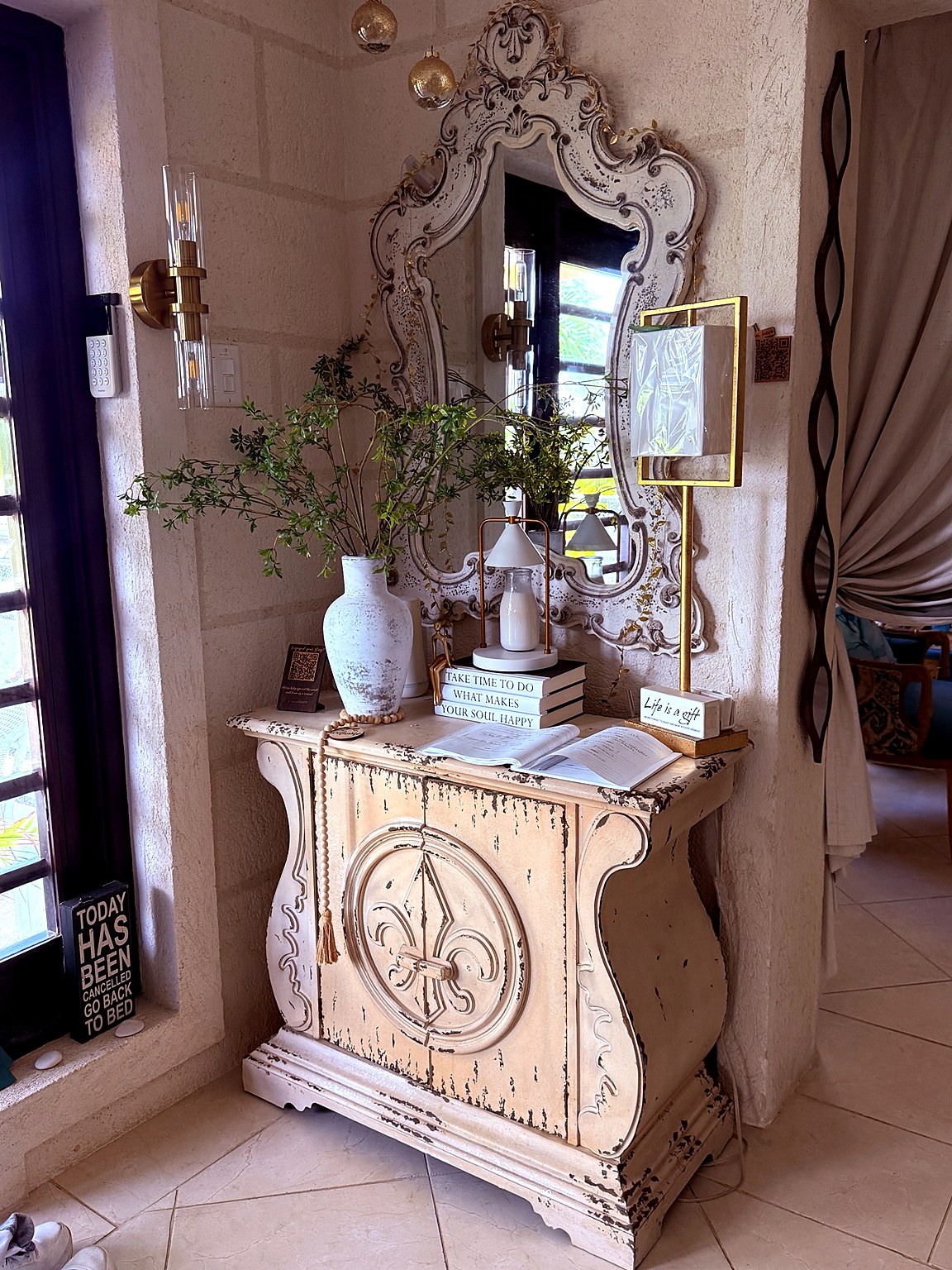 Ornate mirror and console table at Hidden Gem