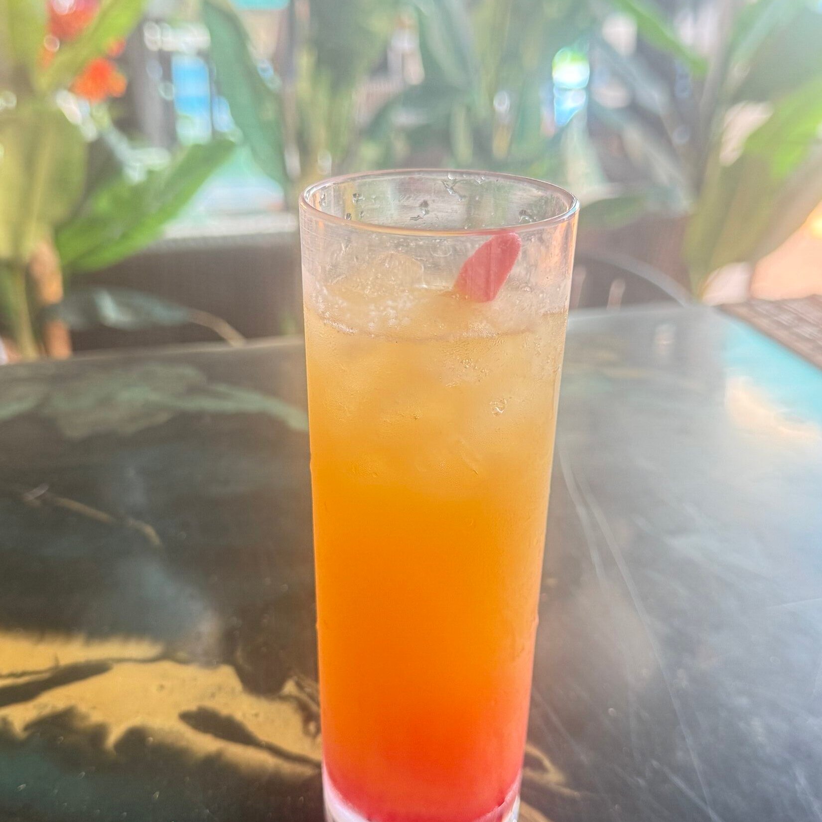 Mimosa cocktails with pineapple and cherry garnish for Brunch Sundays at Hidden Gem
